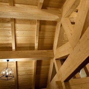 Wood ceiling beams in a log cabin home
